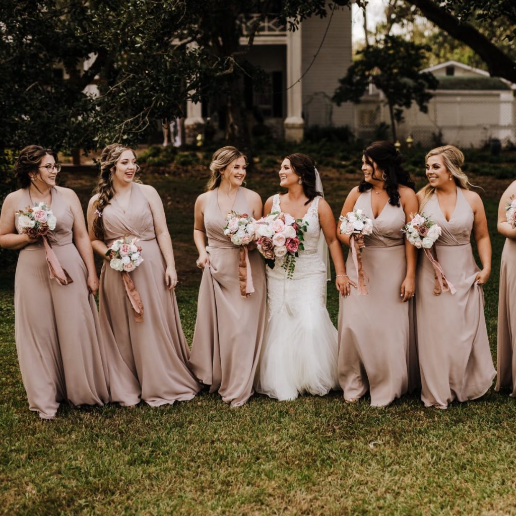 beautiful bridal party in cream colored dresses