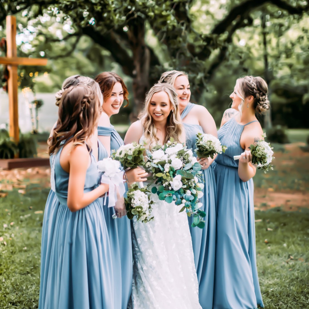 bride and bridesmaids laughing